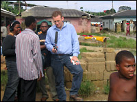 Steve Inskeep conducts an interview in Nigeria. Credit: Jim Wallace, NPR.